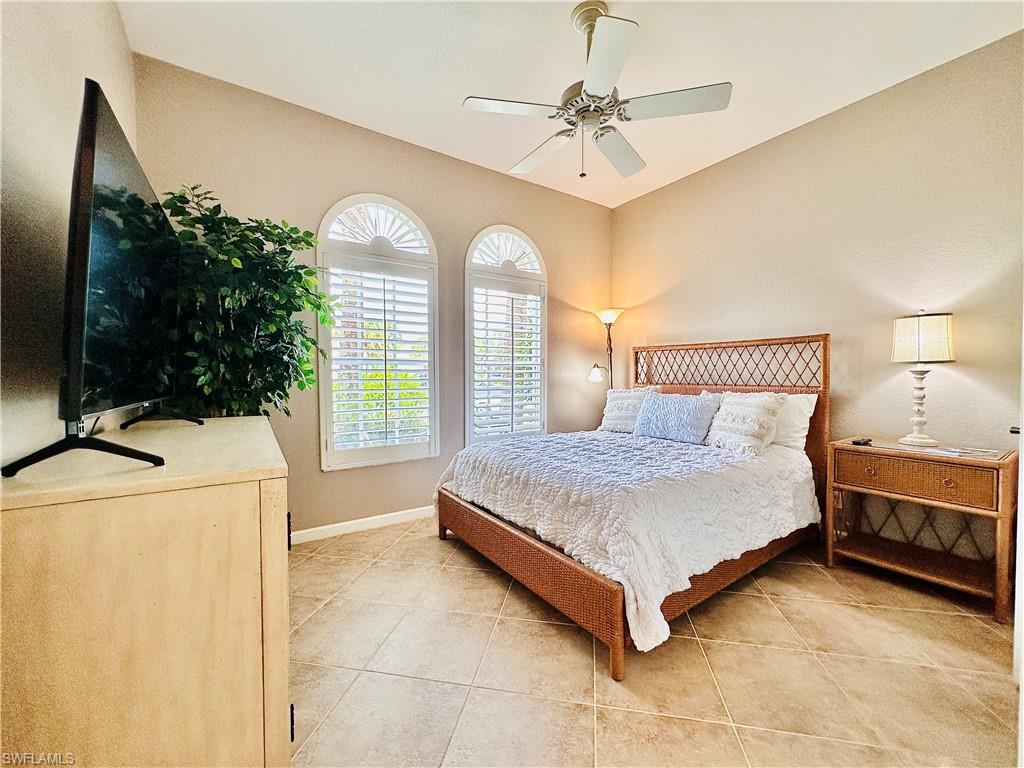 16152 Parque Lane Naples, FL 34110 - Photo 27 of 49 Tiled bedroom with ceiling fan