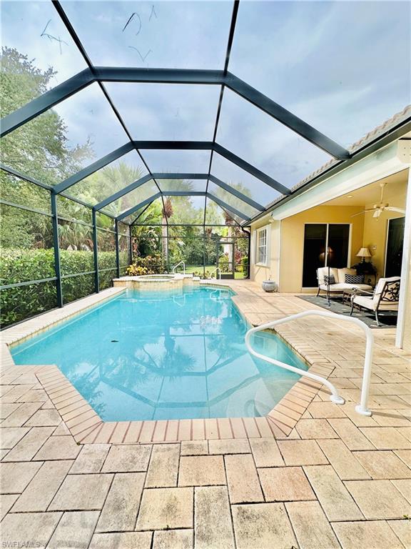 16152 Parque Lane Naples, FL 34110 - Photo 31 of 49 View of pool with a patio and a lanai
