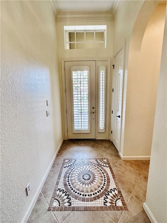 16152 Parque Lane Naples, FL 34110 - Photo 4 of 49 Tiled foyer featuring ornamental molding