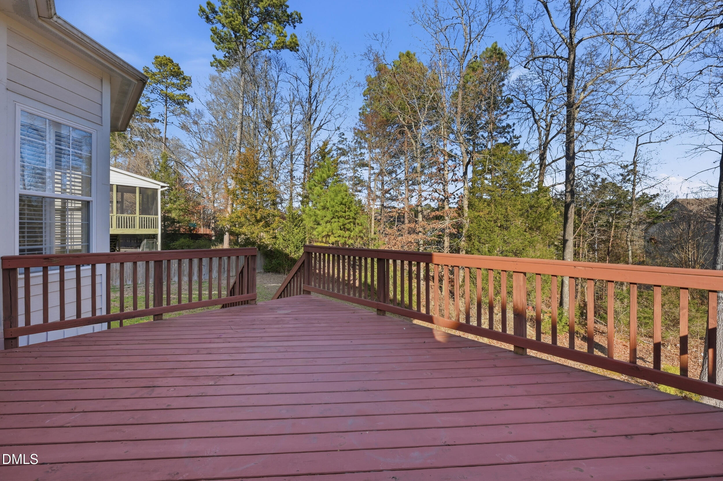 4803 Marena Place Durham, NC 27707 - Photo 31 of 42 a balcony with trees in front of it