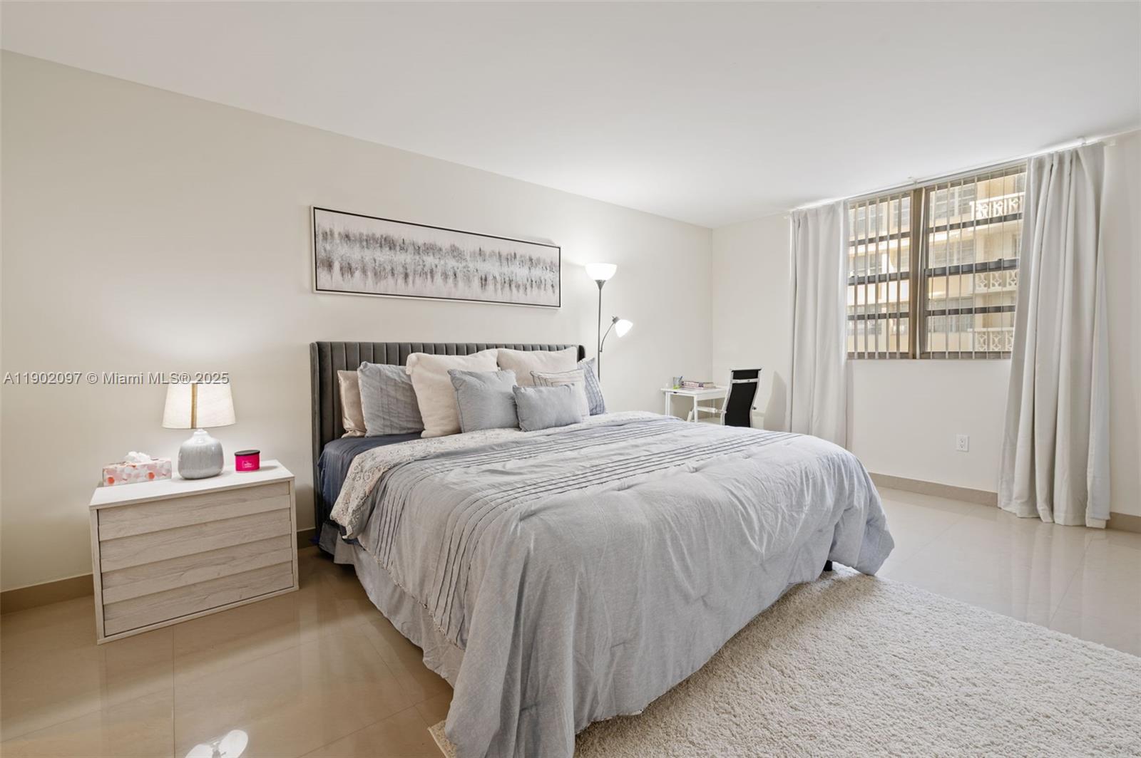 1833 South Ocean Drive, Unit 809 Hallandale Beach, FL 33009 - Photo 14 of 26 a bedroom with a bed and a window