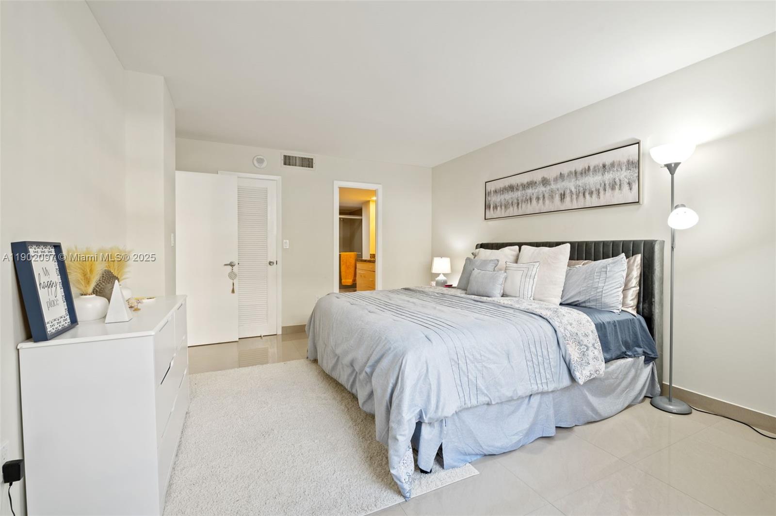 1833 South Ocean Drive, Unit 809 Hallandale Beach, FL 33009 - Photo 15 of 26 a bedroom with a bed and a couch