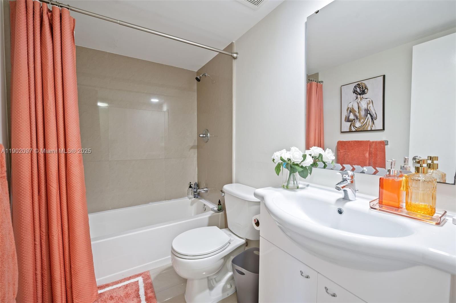 1833 South Ocean Drive, Unit 809 Hallandale Beach, FL 33009 - Photo 20 of 26 a bathroom with a sink a toilet and shower