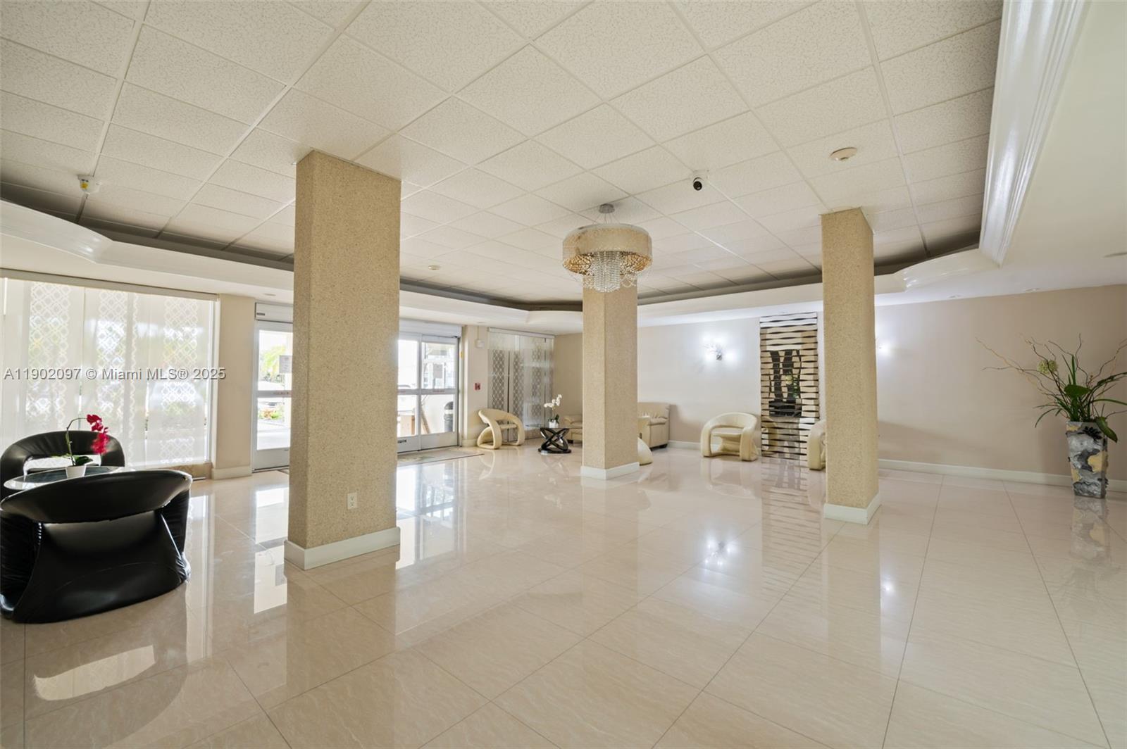 1833 South Ocean Drive, Unit 809 Hallandale Beach, FL 33009 - Photo 4 of 26 a lobby with furniture and floor to ceiling window