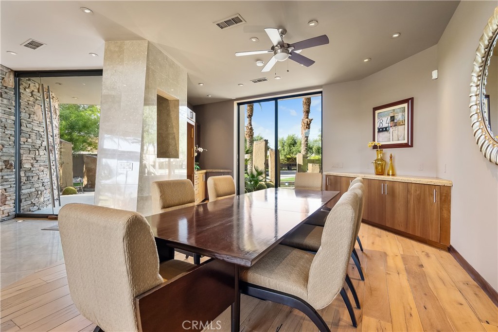 68 Royal St Georges Way Rancho Mirage, CA 92270 - Photo 31 of 75 a view of a dining room with furniture window and wooden floor