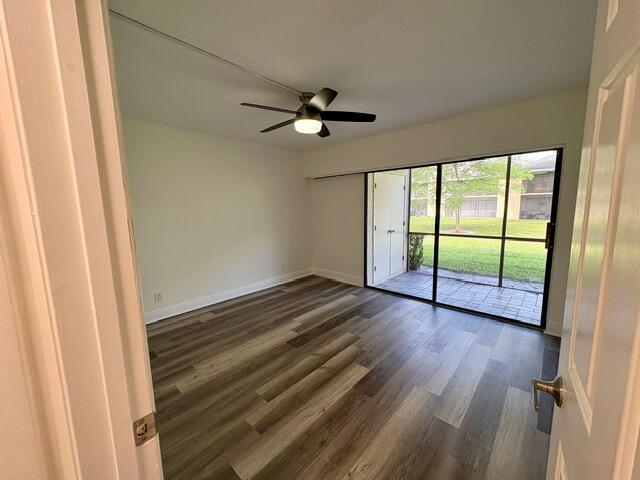 3939 Northeast 5th Avenue, Unit B102 Boca Raton, FL 33431 - Photo 11 of 20 wooden floor in an empty room with a window