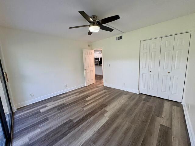 3939 Northeast 5th Avenue, Unit B102 Boca Raton, FL 33431 - Photo 12 of 20 a view of an empty room and wooden floor