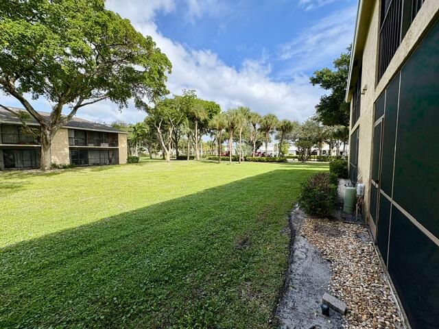 3939 Northeast 5th Avenue, Unit B102 Boca Raton, FL 33431 - Photo 15 of 20 a view of a patio with a yard