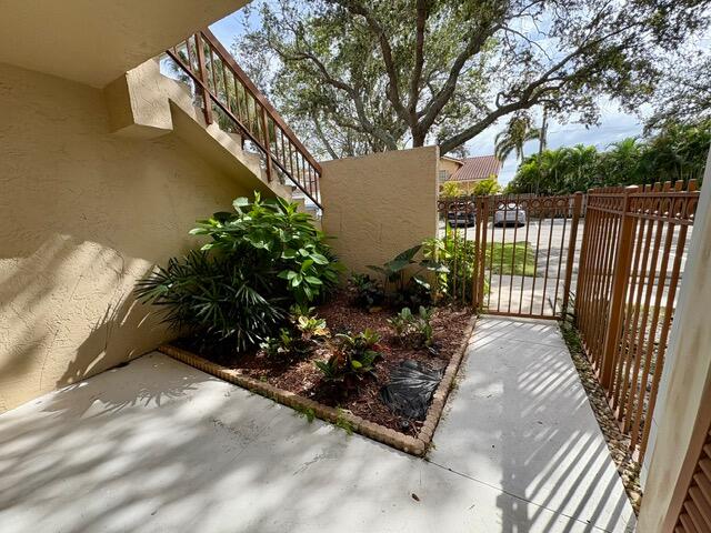 3939 Northeast 5th Avenue, Unit B102 Boca Raton, FL 33431 - Photo 16 of 20 a view of a pathway with a garden