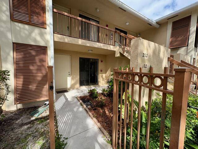 3939 Northeast 5th Avenue, Unit B102 Boca Raton, FL 33431 - Photo 17 of 20 a view of a entryway door of the house