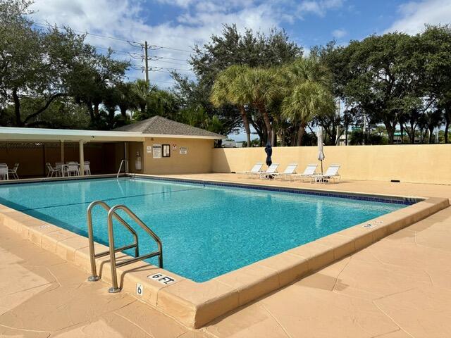 3939 Northeast 5th Avenue, Unit B102 Boca Raton, FL 33431 - Photo 20 of 20 a view of a swimming pool with chairs