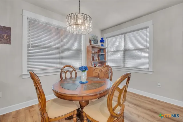 a table and chairs in a patio