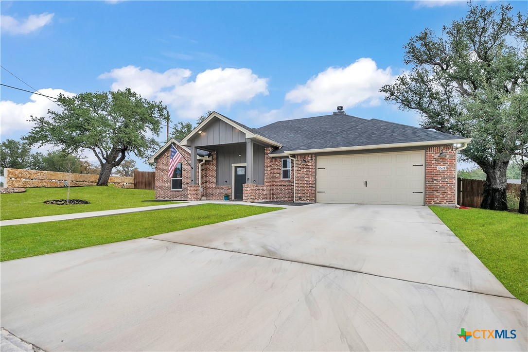 1601 Badger Lane Lampasas, TX 76550 - Photo 2 of 29 a view of a house with a yard and large trees