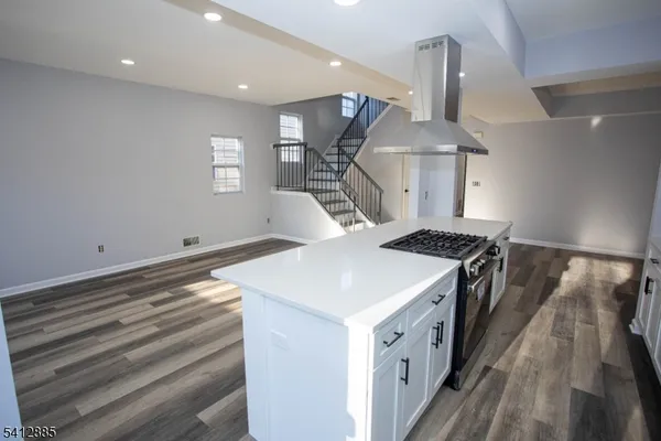 a kitchen with a stove and a sink