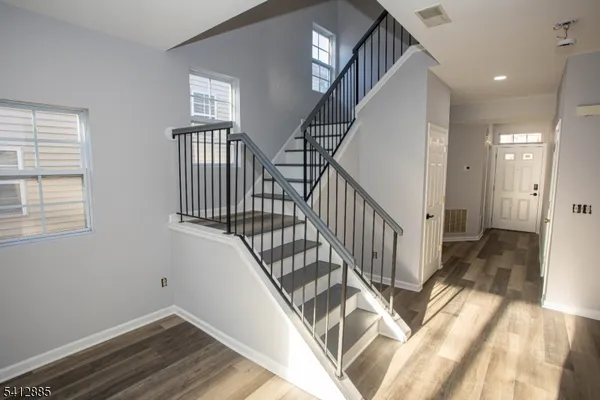 a view of entryway with wooden floor