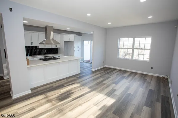 a kitchen with granite countertop a stove and a sink