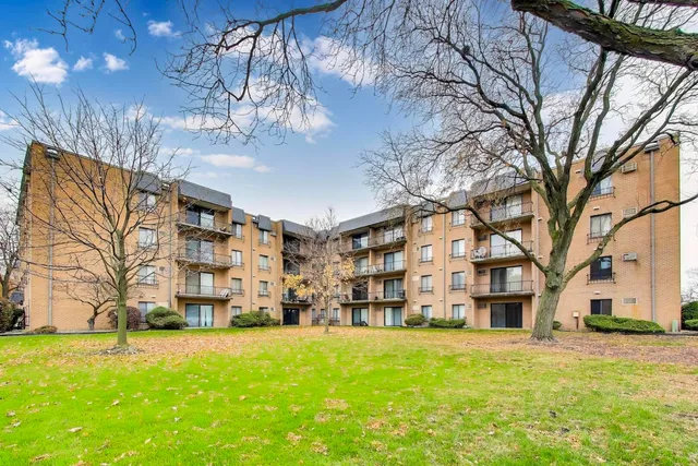 a view of a building with a yard