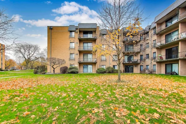 a tall building with trees in front of it