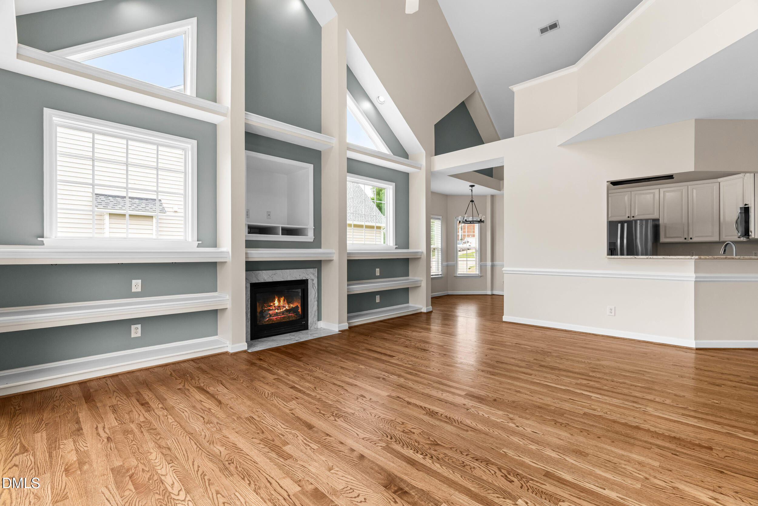 744 Seastone Street Raleigh, NC 27603 - Photo 16 of 53 a view of a living room with furniture and a fireplace