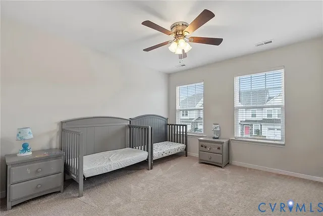 a bedroom with furniture and window