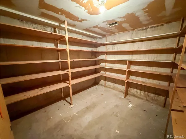 a view of an empty room with empty shelves