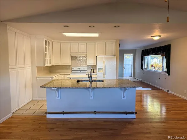 a view of kitchen with wooden floor