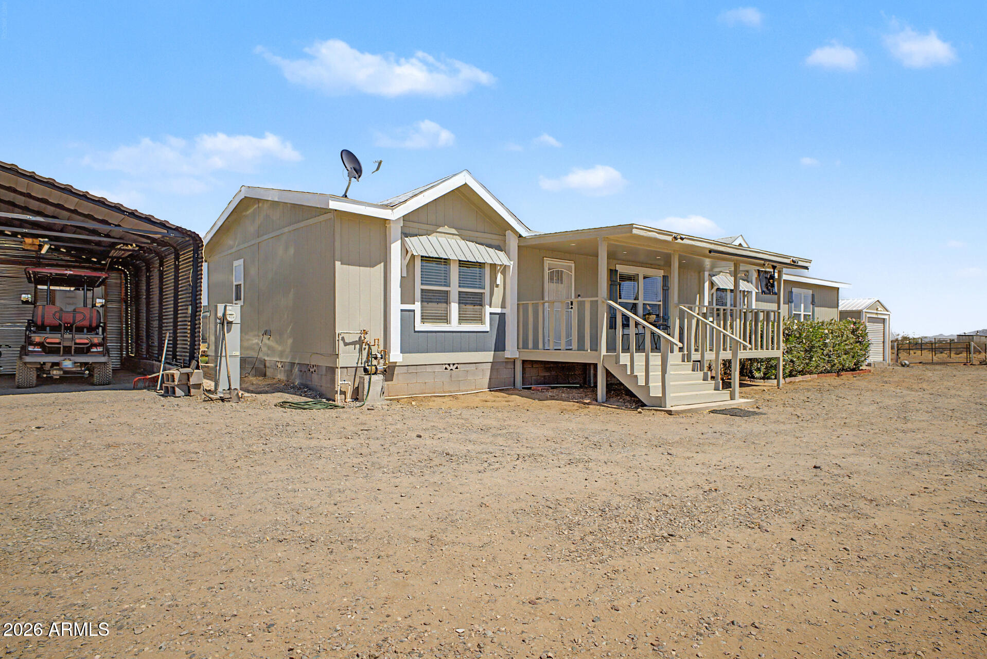 22417 West Dove Valley Road Wittmann, AZ 85361 - Photo 3 of 53 a view of a house with a yard