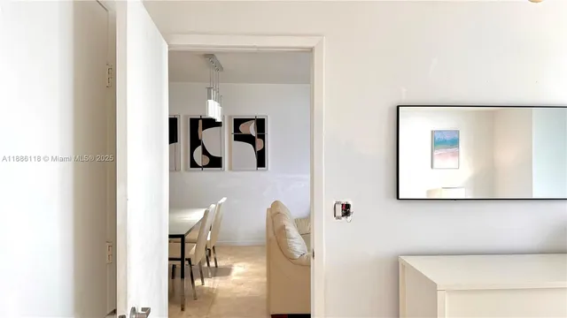 a living room with furniture and large window