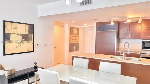 a bathroom with a double vanity sink mirror and shower