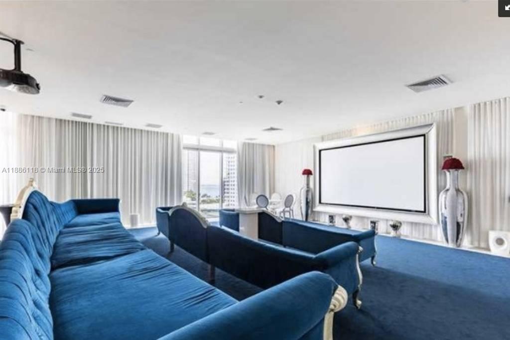 475 Brickell Avenue, Unit 2512 Miami, FL 33131 - Photo 55 of 59 a living room with furniture and a flat screen tv