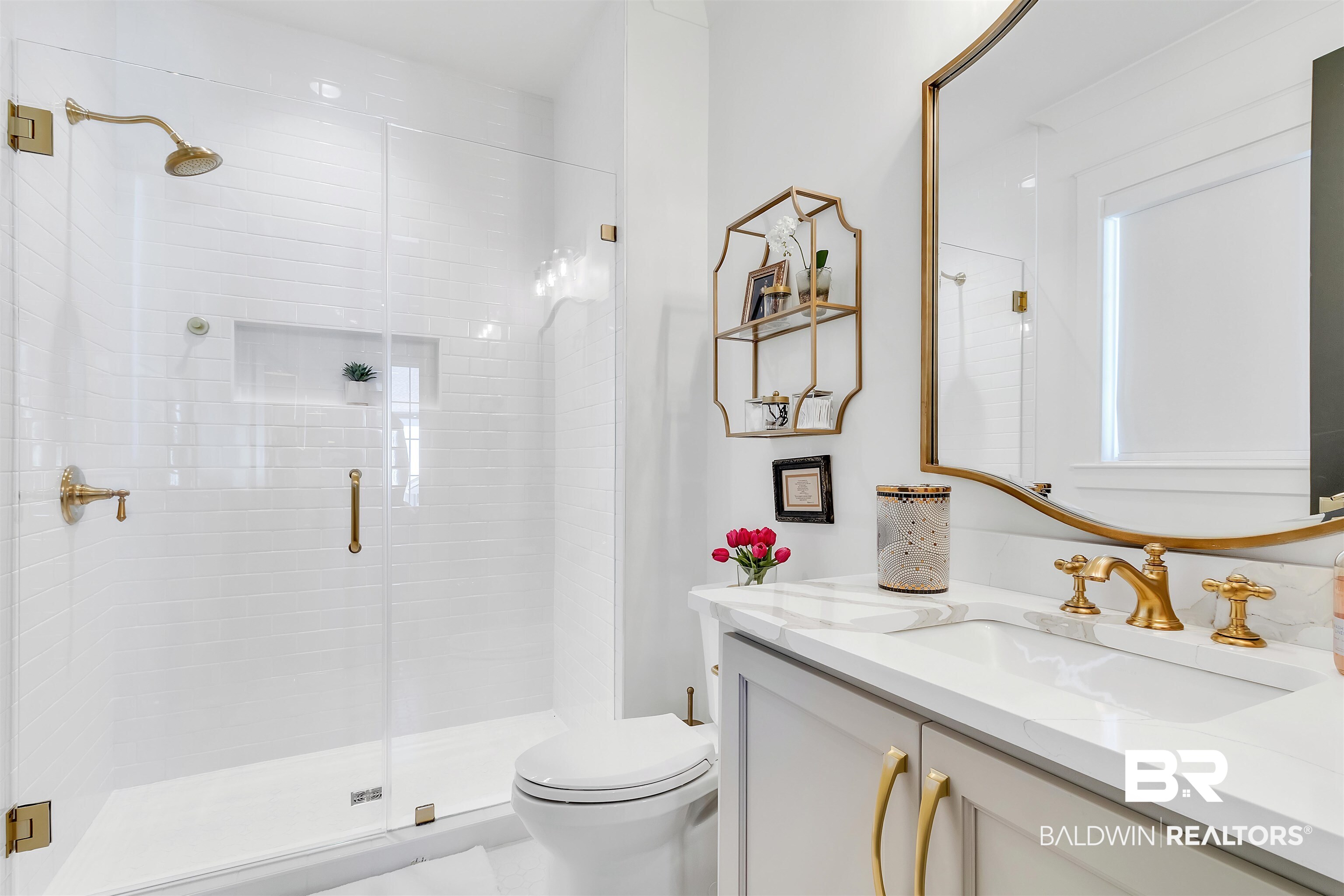 885 Inlet Circle Gulf Shores, AL 36542 - Photo 26 of 36 Bathroom featuring vanity, toilet, and a shower with shower door