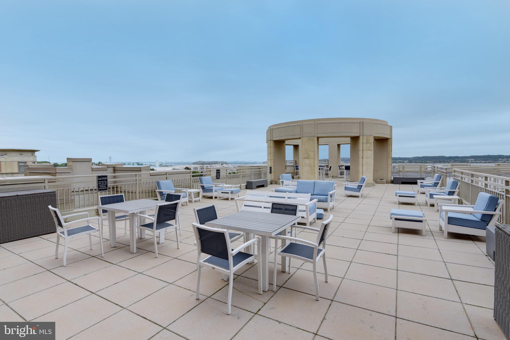 3600 South Glebe Road, Unit 414W Arlington, VA 22202 - Photo 17 of 28 a view of a terrace with furniture and stove