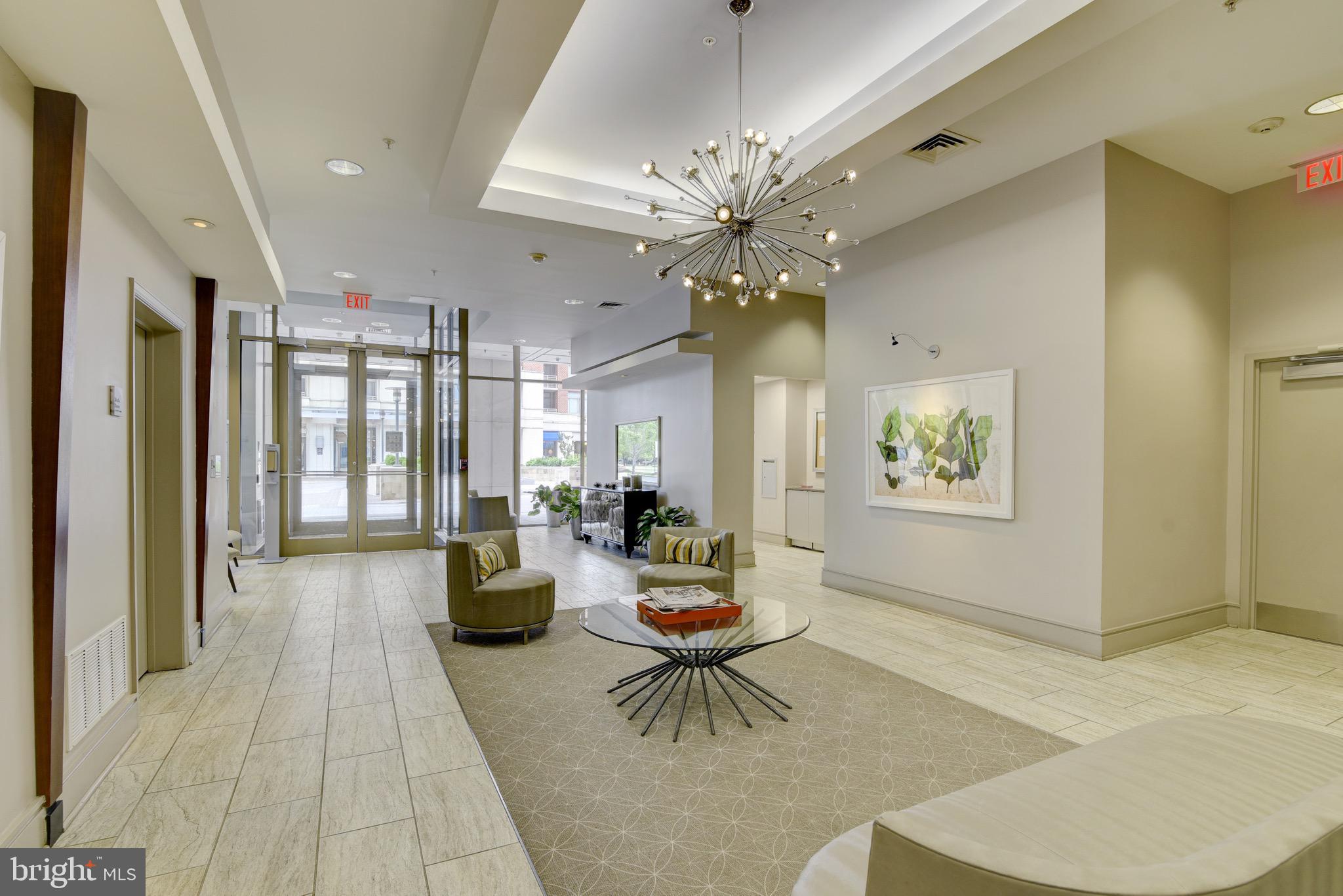 3600 South Glebe Road, Unit 414W Arlington, VA 22202 - Photo 26 of 28 a living room with furniture and a chandelier
