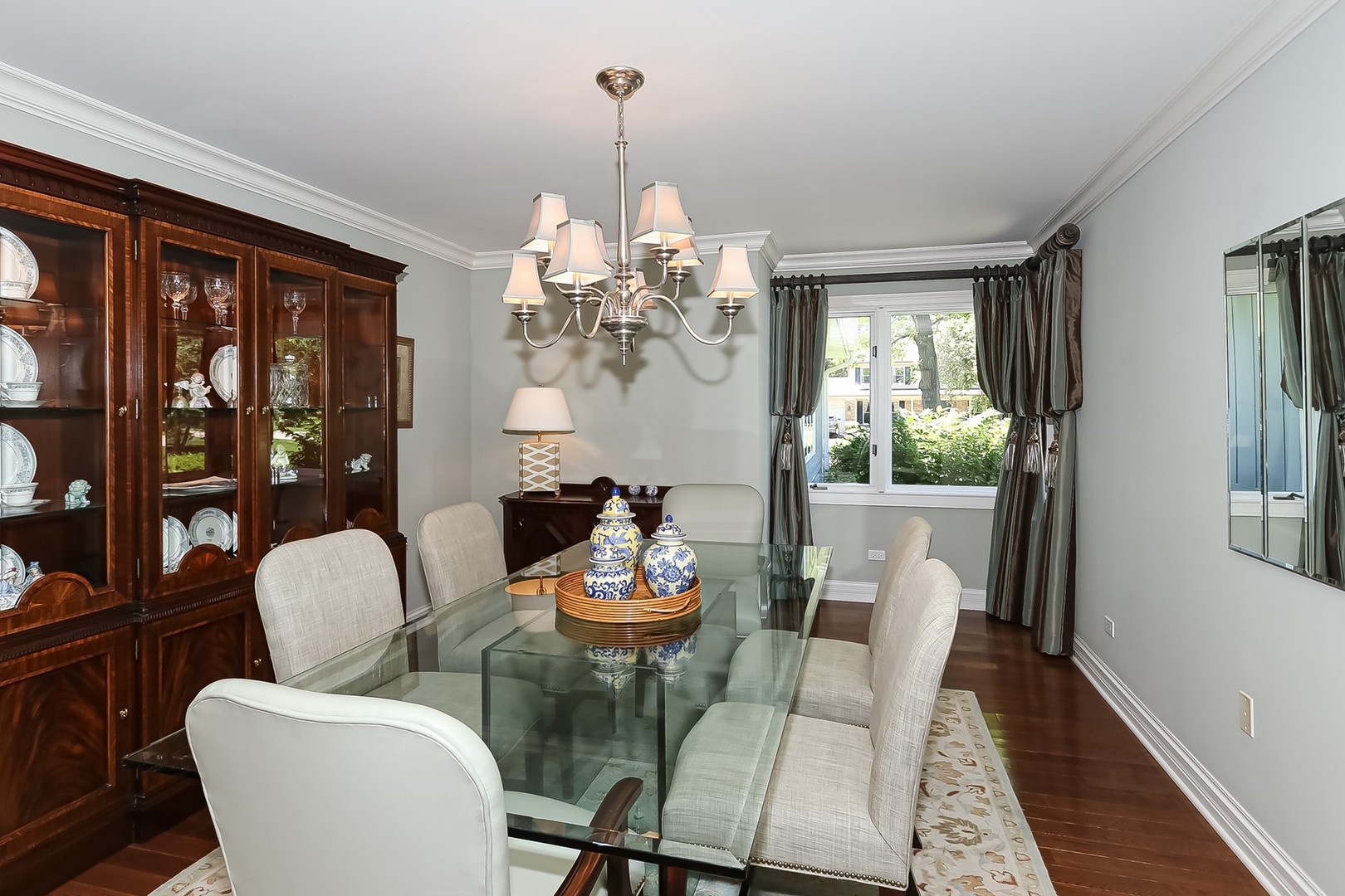 1117 Old Colony Road Lake Forest, IL 60045 - Photo 15 of 45 a dining room with furniture a chandelier and wooden floor