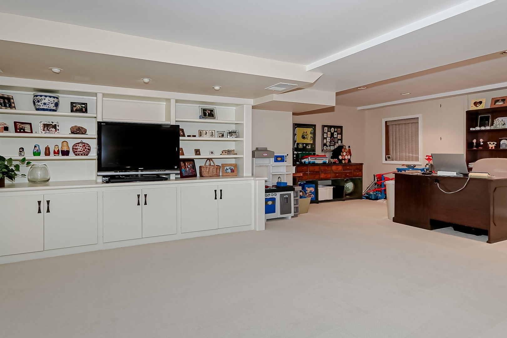 1117 Old Colony Road Lake Forest, IL 60045 - Photo 32 of 45 a living room with furniture and a flat screen tv