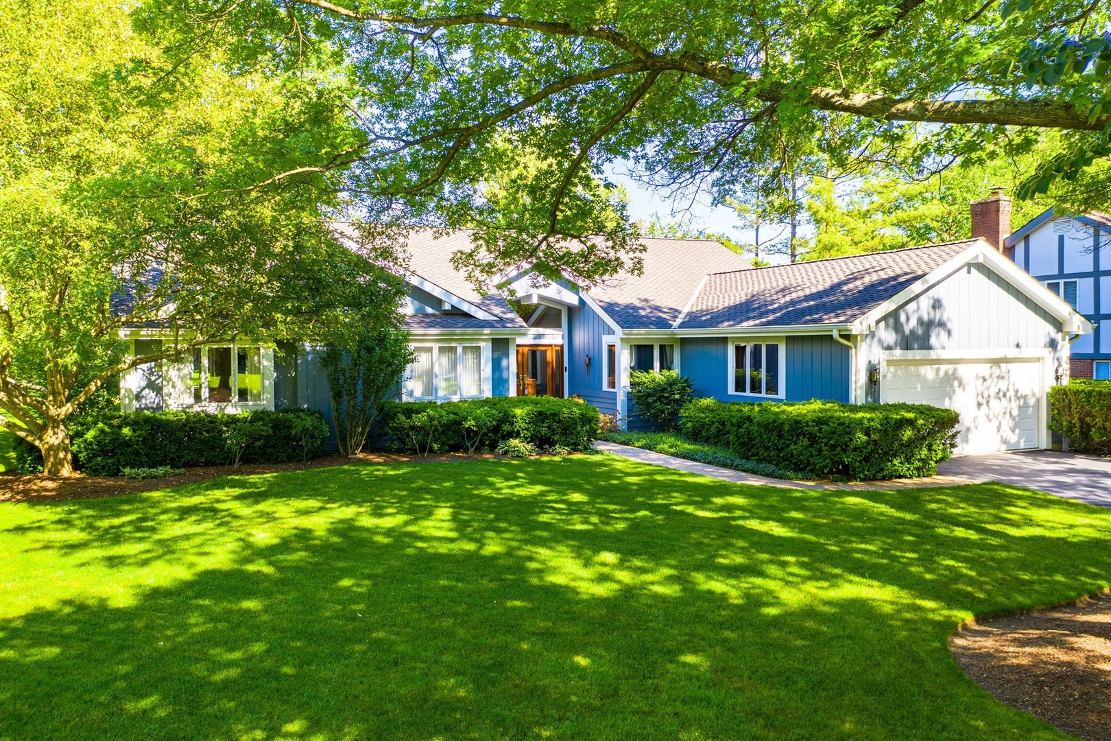 1117 Old Colony Road Lake Forest, IL 60045 - Photo 39 of 45 a view of a house next to a big yard and large trees