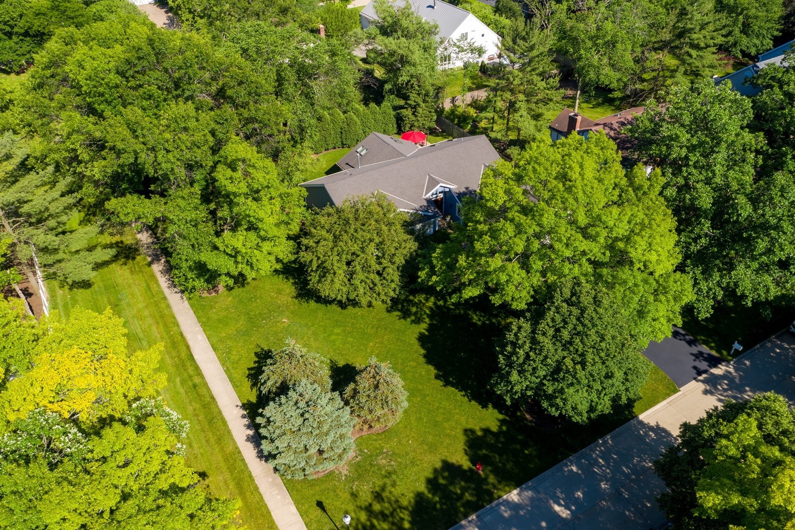 1117 Old Colony Road Lake Forest, IL 60045 - Photo 43 of 45 a backyard of a house with a yard and fountain