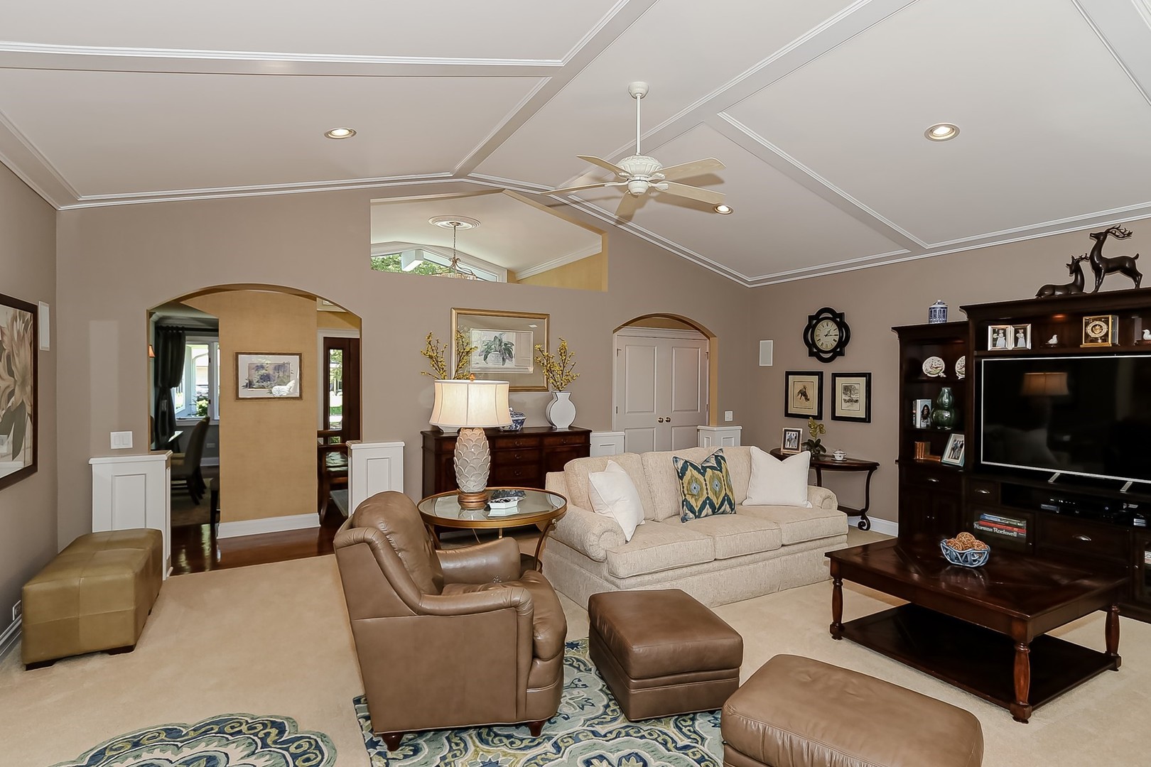 1117 Old Colony Road Lake Forest, IL 60045 - Photo 10 of 45 a living room with furniture a flat screen tv and a chandelier