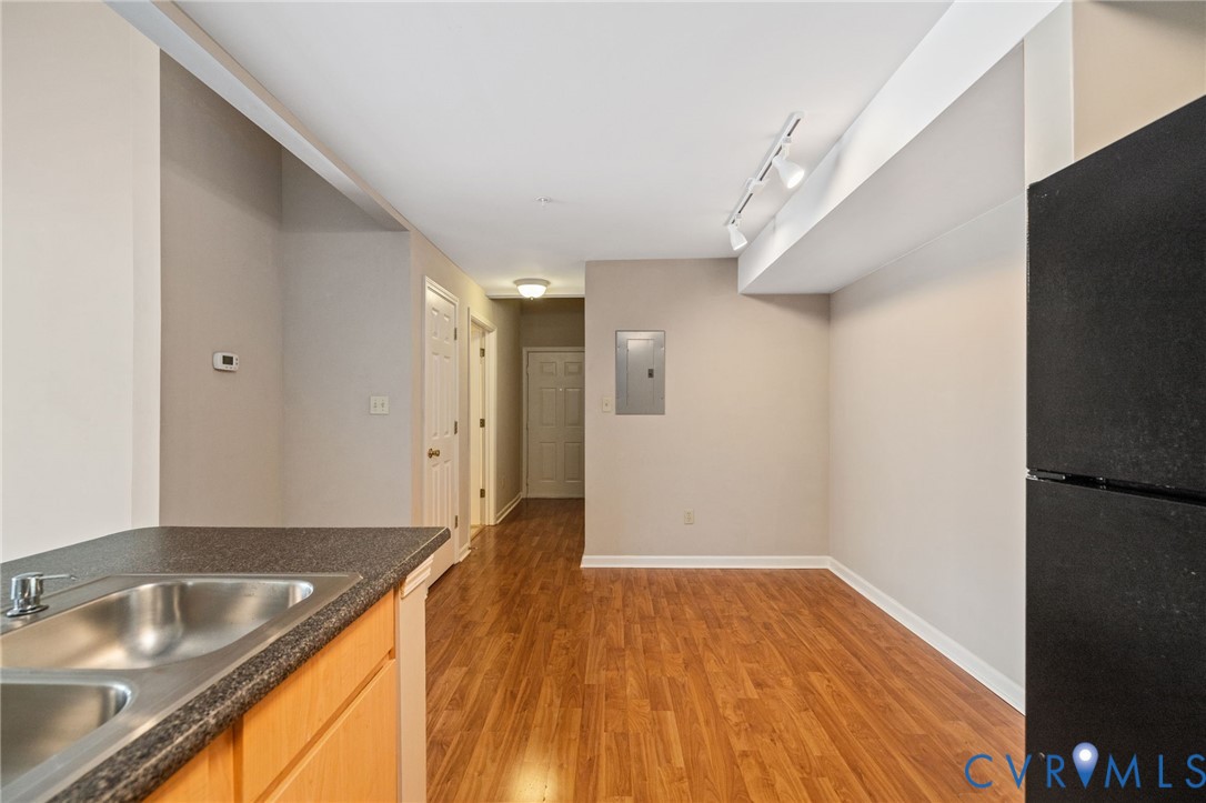 600 Fern Meadow Loop, Unit 308 Midlothian, VA 23114 - Photo 13 of 39 a view of a kitchen with a sink and wooden floor