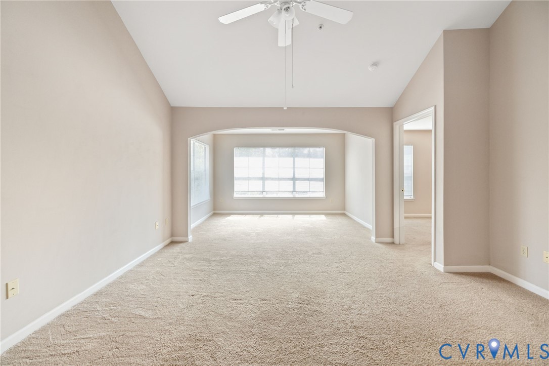 600 Fern Meadow Loop, Unit 308 Midlothian, VA 23114 - Photo 16 of 39 an empty room with windows and chandelier fan
