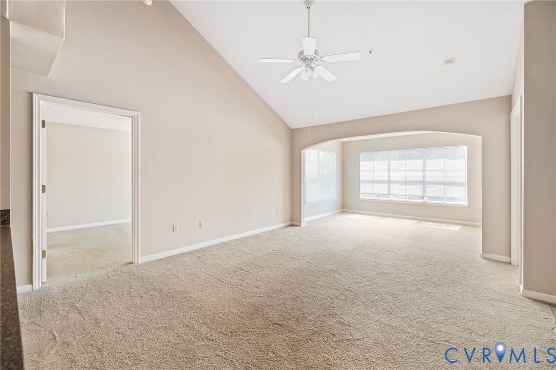 600 Fern Meadow Loop, Unit 308 Midlothian, VA 23114 - Photo 17 of 39 an empty room with chandelier fan and windows