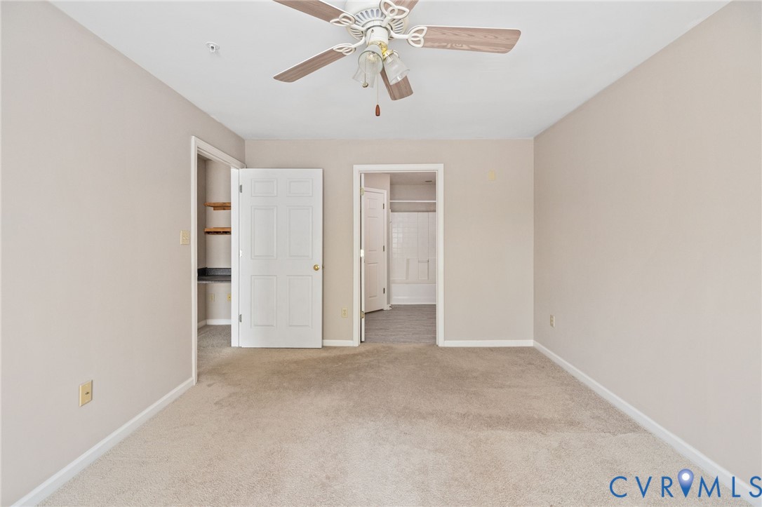 600 Fern Meadow Loop, Unit 308 Midlothian, VA 23114 - Photo 22 of 39 an empty room with chandelier fan