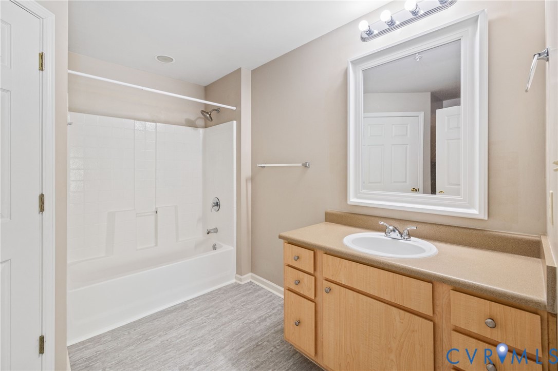 600 Fern Meadow Loop, Unit 308 Midlothian, VA 23114 - Photo 25 of 39 a bathroom with a sink and a mirror