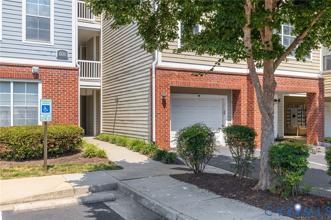 600 Fern Meadow Loop, Unit 308 Midlothian, VA 23114 - Photo 5 of 39 a front view of a house with plants