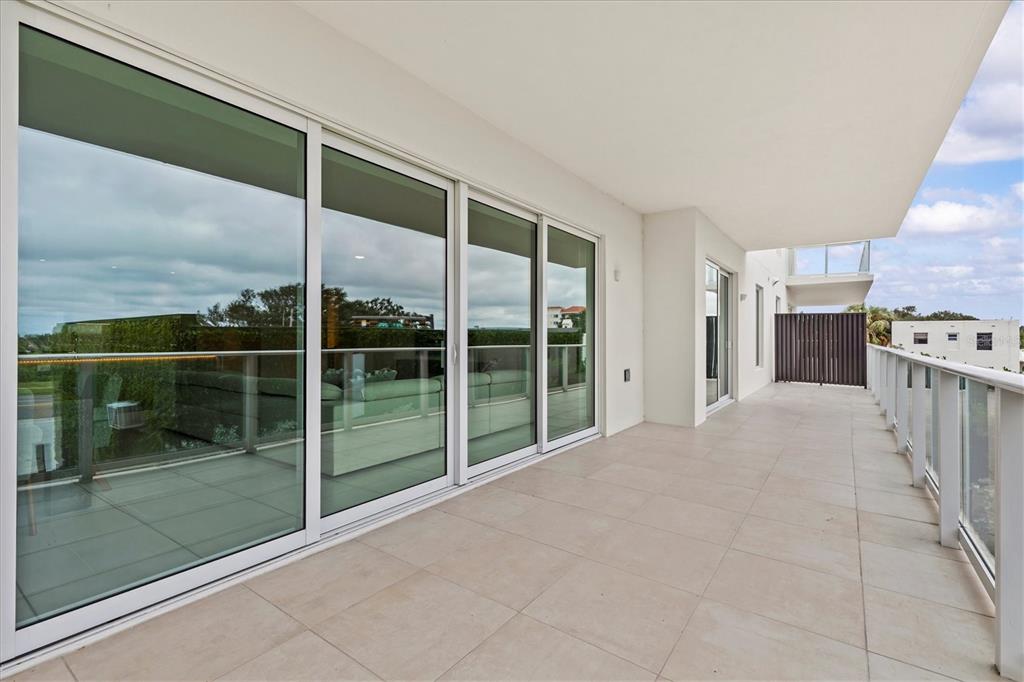 1020 Sunset Point Road, Unit 108 Clearwater, FL 33755 - Photo 28 of 62 a view of a room with floor to ceiling windows and kitchen view