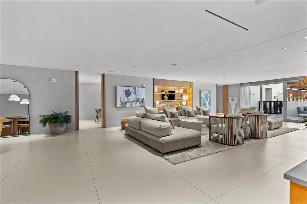 1020 Sunset Point Road, Unit 108 Clearwater, FL 33755 - Photo 36 of 62 a living room with furniture and view of kitchen