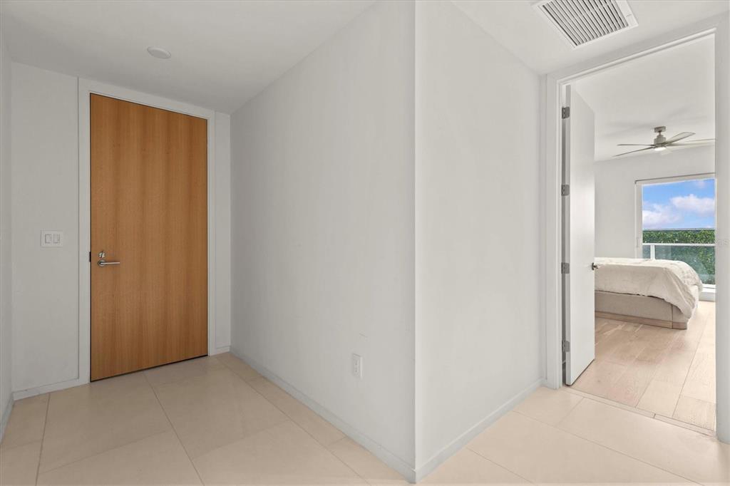 1020 Sunset Point Road, Unit 108 Clearwater, FL 33755 - Photo 7 of 62 a view of a bedroom from the hallway