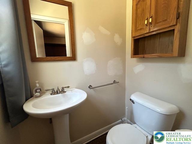 2065 Hopewell Road Bethlehem, PA 18017 - Photo 15 of 19 Functional half bathroom featuring a pedestal sink and convenient overhead storage.