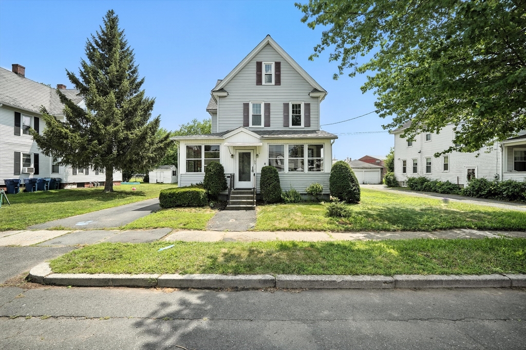a front view of a house with a yard