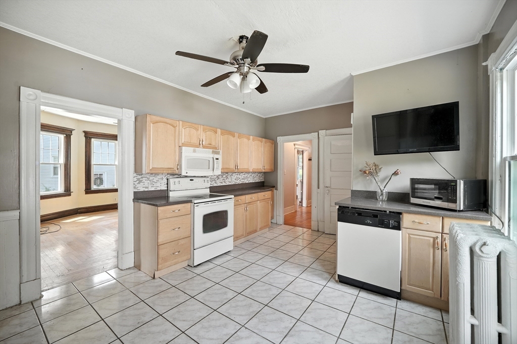 36 Maple Terrace West Springfield, MA 01089 - Photo 12 of 33 a kitchen with granite countertop a sink appliances cabinets and furniture